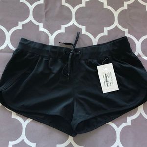 Black boy shorts . Bathing suit. NWT. Says medium more like small. See photos